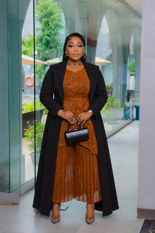 Serena Shimmer Miyake pleated capri set styled with a long coat in Copper Brown; coat not included.