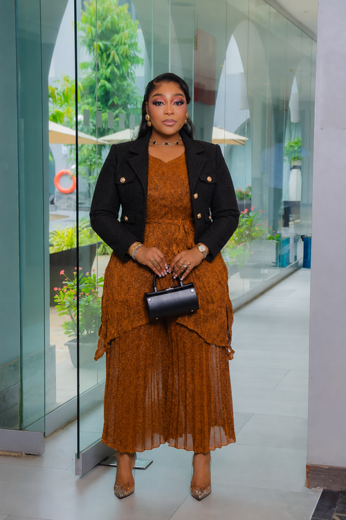 Serena Shimmer Miyake pleated capri set styled with a blazer in Copper Brown; blazer not included.