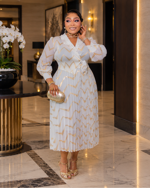 Liora ivory/White and gold zigzag Miyake pleated midi dress with wrap-style front, waist tie and flowing skirt – DivAbby